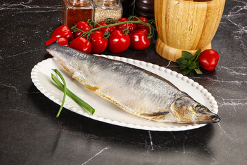 Whole raw salted herring fish