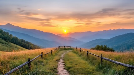 As the sun dips below the horizon, hues of orange, pink, and purple spread across the sky, casting a warm glow over the serene mountain range below.