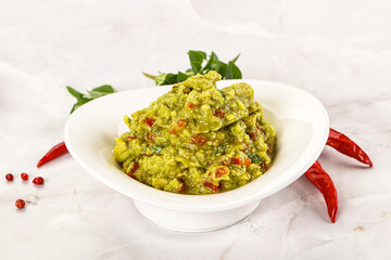 Guacamole with avocado, tomato and chili