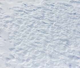 Obraz premium A snow covered ground with a few footprints