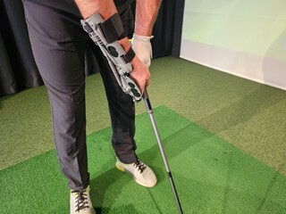 Golf training session with specialized grip aids at indoor facility enhancing technique and performance concept