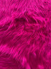 Naklejka premium A pink fur texture with a shiny appearance