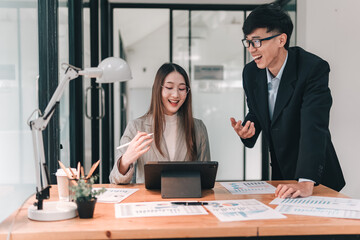 Team collaboration during a strategy meeting in a modern office space with engaged discussion and presentations