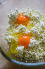 Fresh eggs and cottage cheese close-up for cooking or baking ingredients. High quality photo