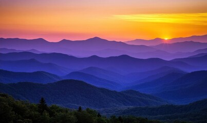 Fototapeta premium Serene mountain landscape at sunset with layered hills and vibrant colors.