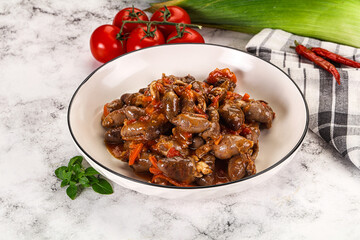 Baked chicken hearts with vegetables