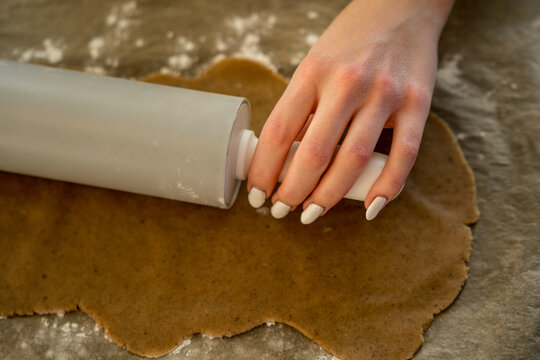 Dough rolled on parchment paper for baking