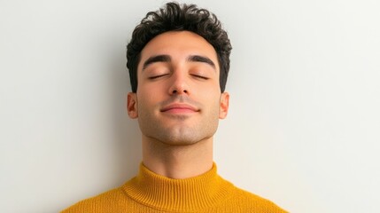 Obraz premium Close up Portrait of a Young Male Model With Tranquil Peaceful Expression Isolated on White Studio Background