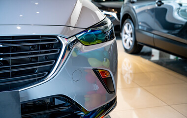 Car parked in luxury showroom. Car dealership office. Car showroom business. New car parked in...