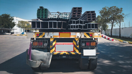 steel construction products H-beam on transport vehicle.iron steel store in warehouse heavy...