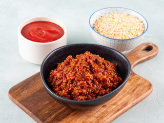 Vegan tomato bolognese ragu with soya protein granules in bowl