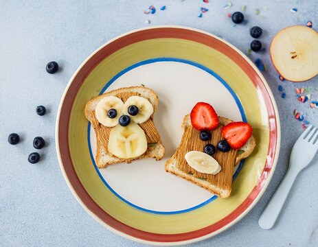 Funny animal faces on toast for a healthy children's breakfast