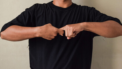 Young man showing gestures in sign language