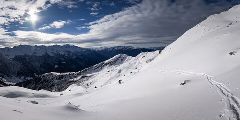 Ski touring in the french Alps. Full of fresh snow. Panorama