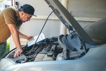 Close up Man hands fixing Car machinery vehicle mechanical service. Mechanic man hands repairing...