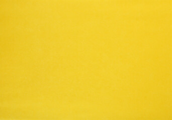 Obraz premium Yellow paper texture. Grainy surface. Abstract background.
