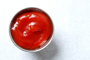 Bowl of ketchup or tomato sauce. Vegan. Ingredients for salad. Organic food