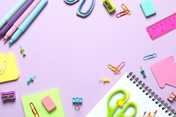 Flat lay with school stationery on color background, top view