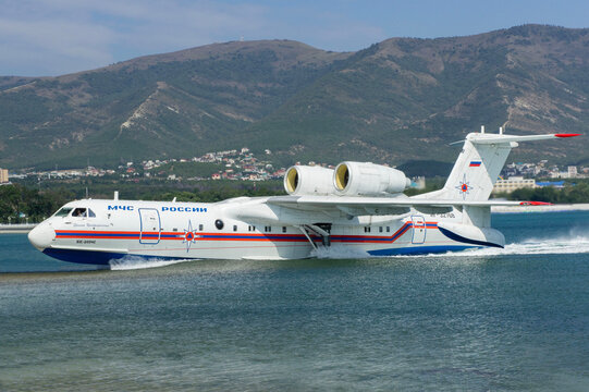 Hydroaviation salon 2010. Russian amphibious aircraft (flying boat) Be-200 "Altair" floats along Gelendzhik Bay after landing on water. Close-up of airplane. Gelendzhik, Russia - September 09, 2010