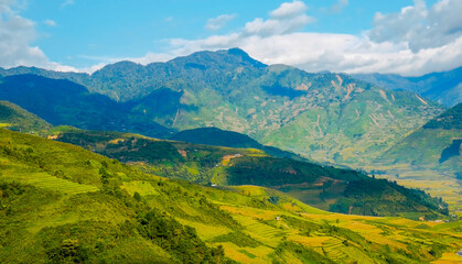 Beautiful landscape mountain green field grass meadow white cloud blue sky on sunny day. Majestic green scenery big mountain hill cloudscape valley panorama view in countryside greenery pasture