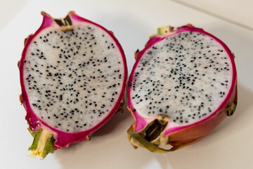 half of fresh dragon fruit with half and pitaya