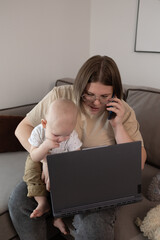 A dedicated mother is expertly balancing her work obligations and caring for her baby while using a...