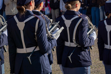 Fototapeta premium Italian soldiers wearing formal uniforms during parade on sunny day showcasing discipline and unity.