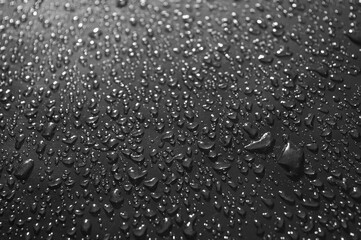 water drops on grey glass close up