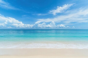 Obraz premium A serene beach scene with clear blue waters and a bright sky.