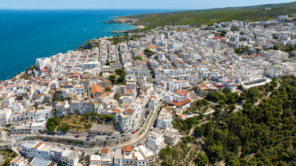 Obraz premium Aerial view of the town of Peschici, in the province of Foggia, Puglia, Italy. It is a tourist destination in Gargano overlooking the Adriatic Sea.