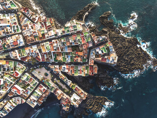 aerial view of a very colorful coastal neighborhood in Tenerife  © Jacin