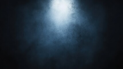 Obraz premium A dark, misty background with a central light source.