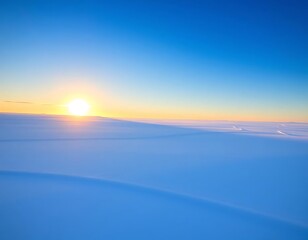 Fototapeta premium golden light of the sun casts a breathtaking spell of peace upon the pristine expanse of snow