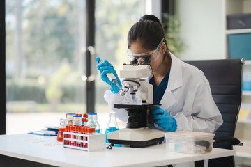 Lab work, Doctor holds a test tube takes the test from a test tube in analysis, blood, DNA, test...