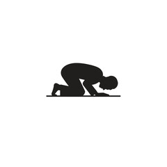 Obraz premium A simple silhouette of a person in a prayer position kneeling with forehead touching the ground, symbolizing devotion and spirituality.