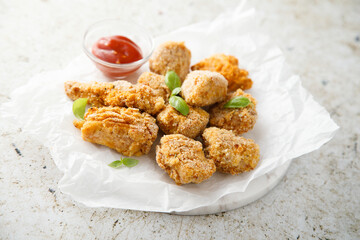 Homemade chicken nuggets with ketchup