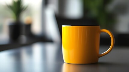 Fototapeta premium A yellow mug with a black rim on a table in front of a blurry background.