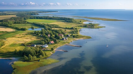 Obraz premium Aerial view of a serene coastal landscape with lush greenery.