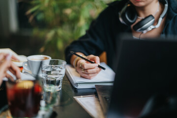 High school students study together in a relaxed coffee shop, collaborating on homework and assignments. The scene is filled with warmth, focus, and concentration in a casual atmosphere.