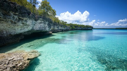 Fototapeta premium Limestone Cliffs by Turquoise Waters, breathtaking natural formations towering over vibrant clear waters, showcasing the serene beauty of an unspoiled tropical paradise.