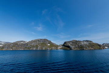 Fototapeta premium Prins Christian Sund Greenland mountain fjord with floating ice and shore iceberg on a summer day