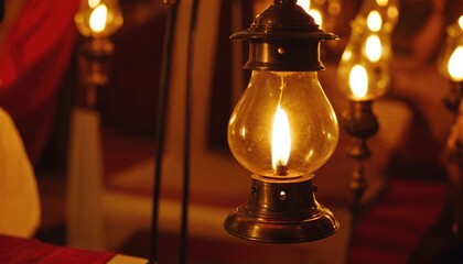 A close-up of a traditional lamp lit during a celebration honoring Babasaheb, reflecting hope and enlightenment