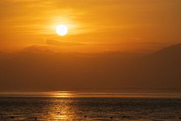 sunrise with clouds over the ocean