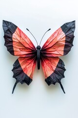 Fototapeta premium A butterfly made of paper is displayed on a white background