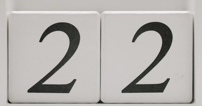 A close-up photograph displaying the number 22 on white wooden blocks. Perfect for significant dates, countdowns, and calendar-related concepts.