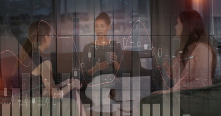 Image of data processing and diagrams over diverse female colleagues talking in office