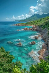 Obraz premium Stunning Coastal Landscape with Turquoise Waters and Rocky Shoreline Under a Clear Blue Sky