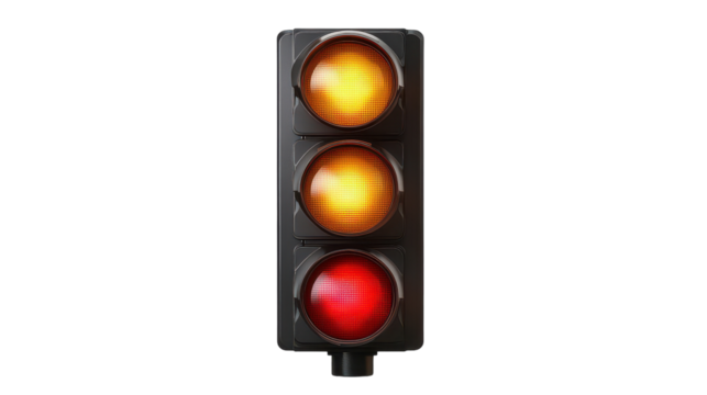 Traffic light glowing at dusk, signaling caution with amber light while the red shines brightly in an urban setting
