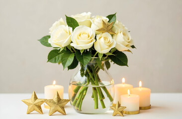 Obraz premium A beautiful bouquet of white roses in a glass vase, complemented by glowing candles and golden star decorations. Perfect for holiday decor, wedding designs, or festive inspiration. Selective focus