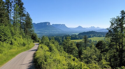 Obraz premium Scenic Mountain Landscape with Clear Blue Sky and Greenery